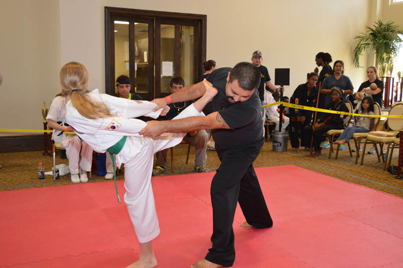 two young martial arts students in sparring match